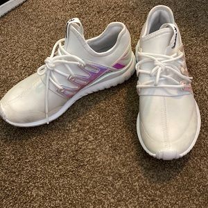Athletic Adidas shoes. Worn a few times. Could be easily cleaned. Size 5